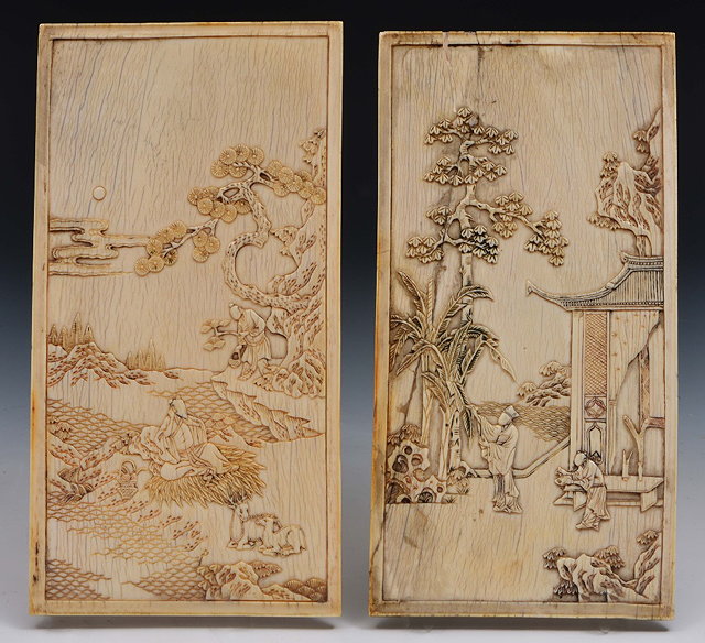 Appraisal: A pair of Chinese ivory table screen panels th Centurycarved