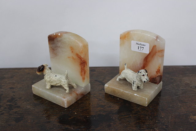 Appraisal: A PAIR OF ART DECO HARDSTONE BOOKENDS each mounted with