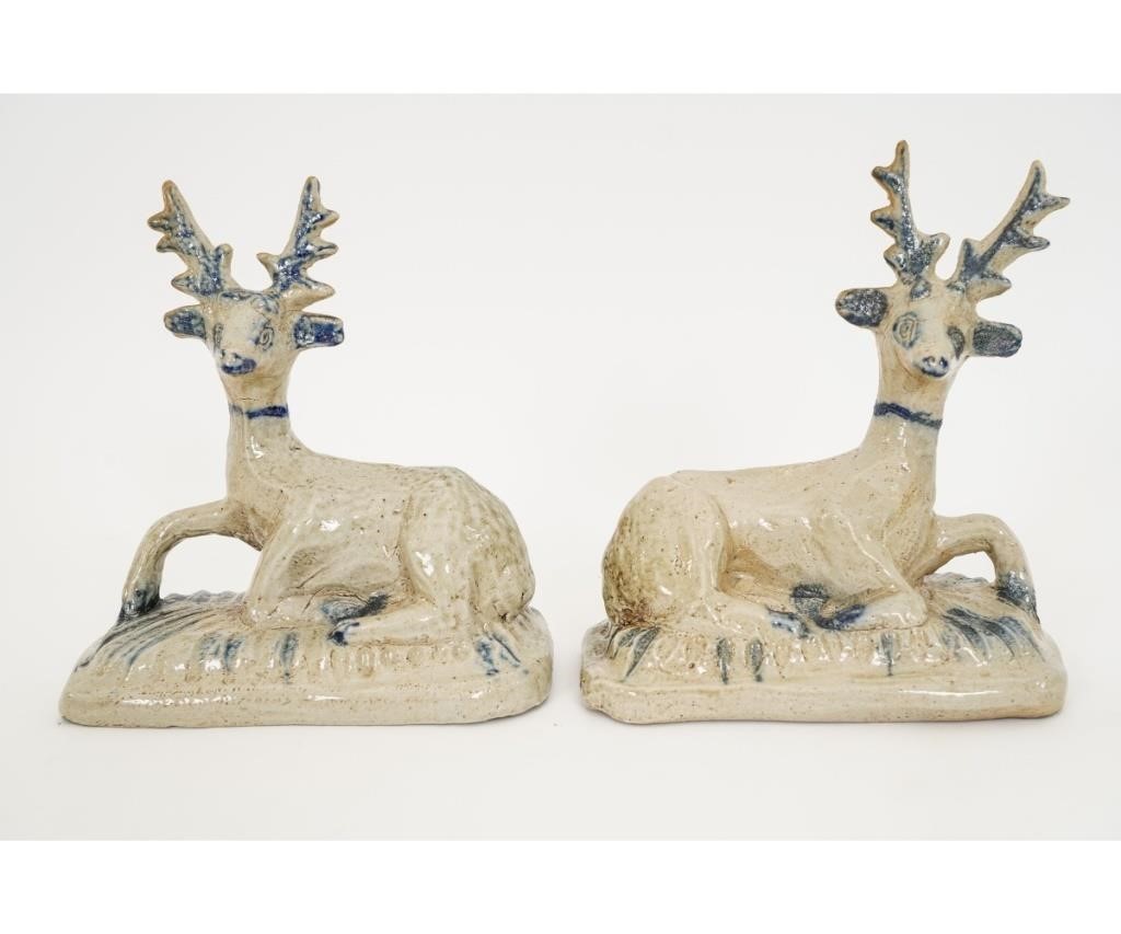 Appraisal: Pair of stoneware recumbent stags each with colorful blue glaze