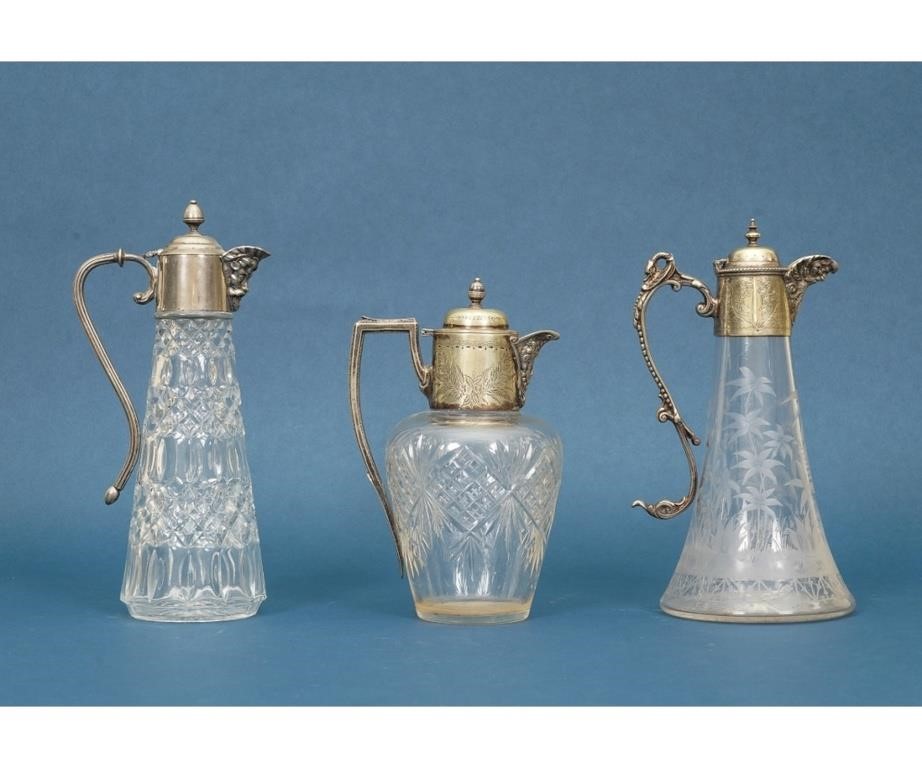 Appraisal: Three silverplate claret jugs one cut glass one etched and