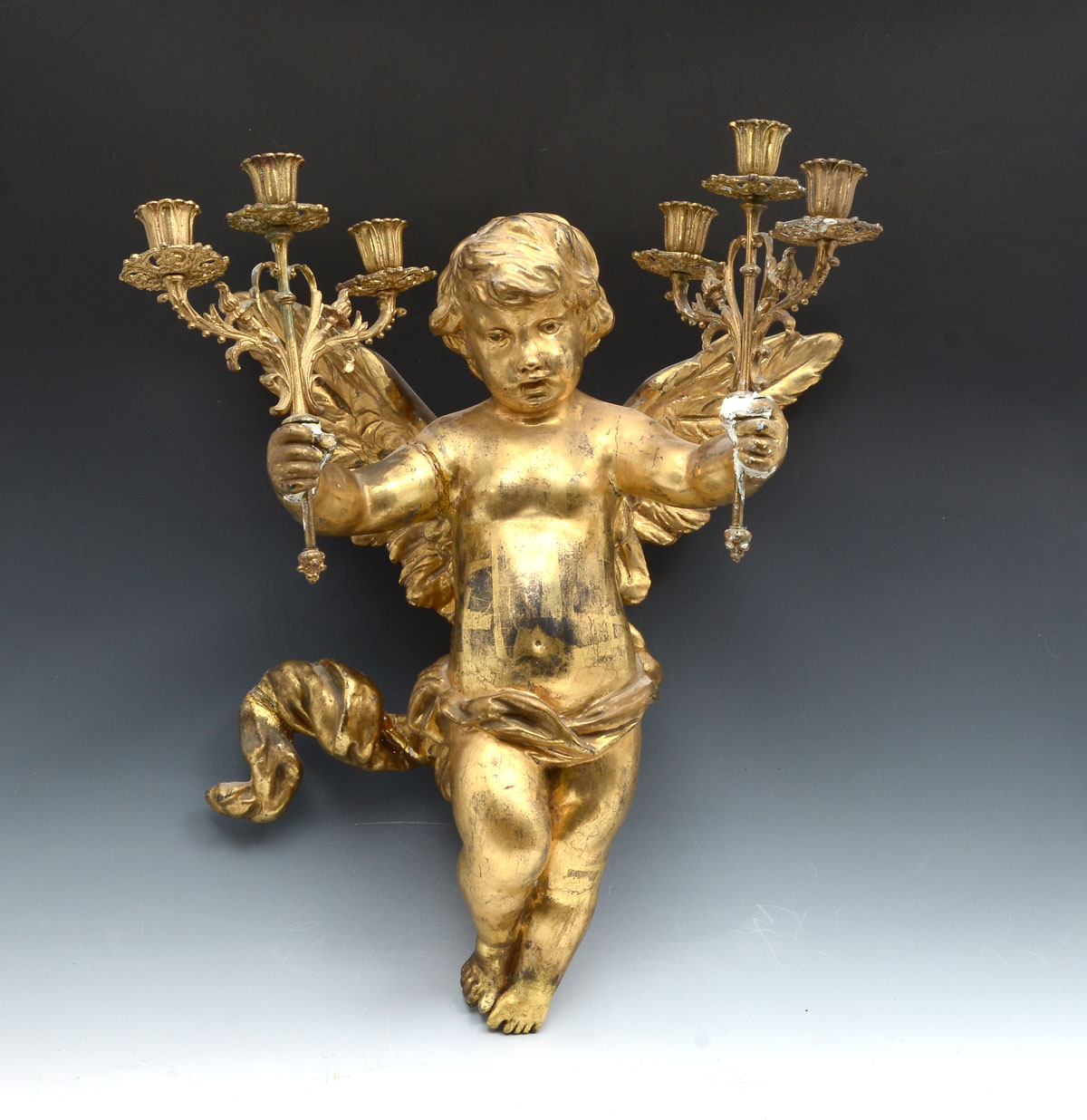 Appraisal: TH CENTURY CARVED CHERUB SCONCE Carved Gilt cherub having a