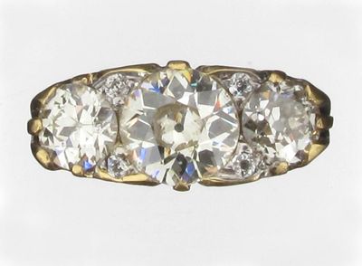 Appraisal: A diamond three stone ring The three circular old cut