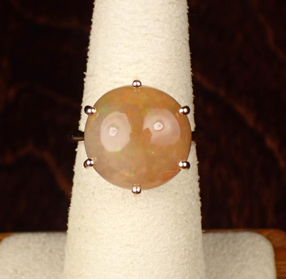 Appraisal: ETHIOPIAN FIRE OPAL AND FOURTEEN KARAT GOLD RING The yellow