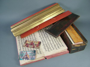 Appraisal: A Tibetan printed and scrivened devotional book with silk covered