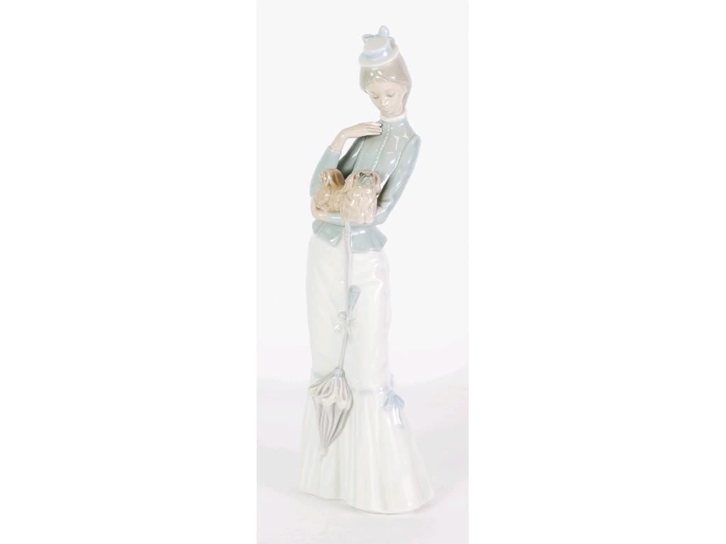 Appraisal: LLADRO PORCELAIN FIGURE OF AN ELEGANT YOUNG LADY CARRYING A