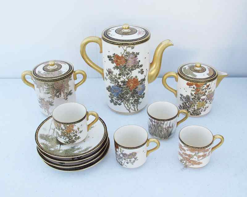 Appraisal: JAPANESE SATSUMA COFFEE SET Hand painted bamboo and prunus tree