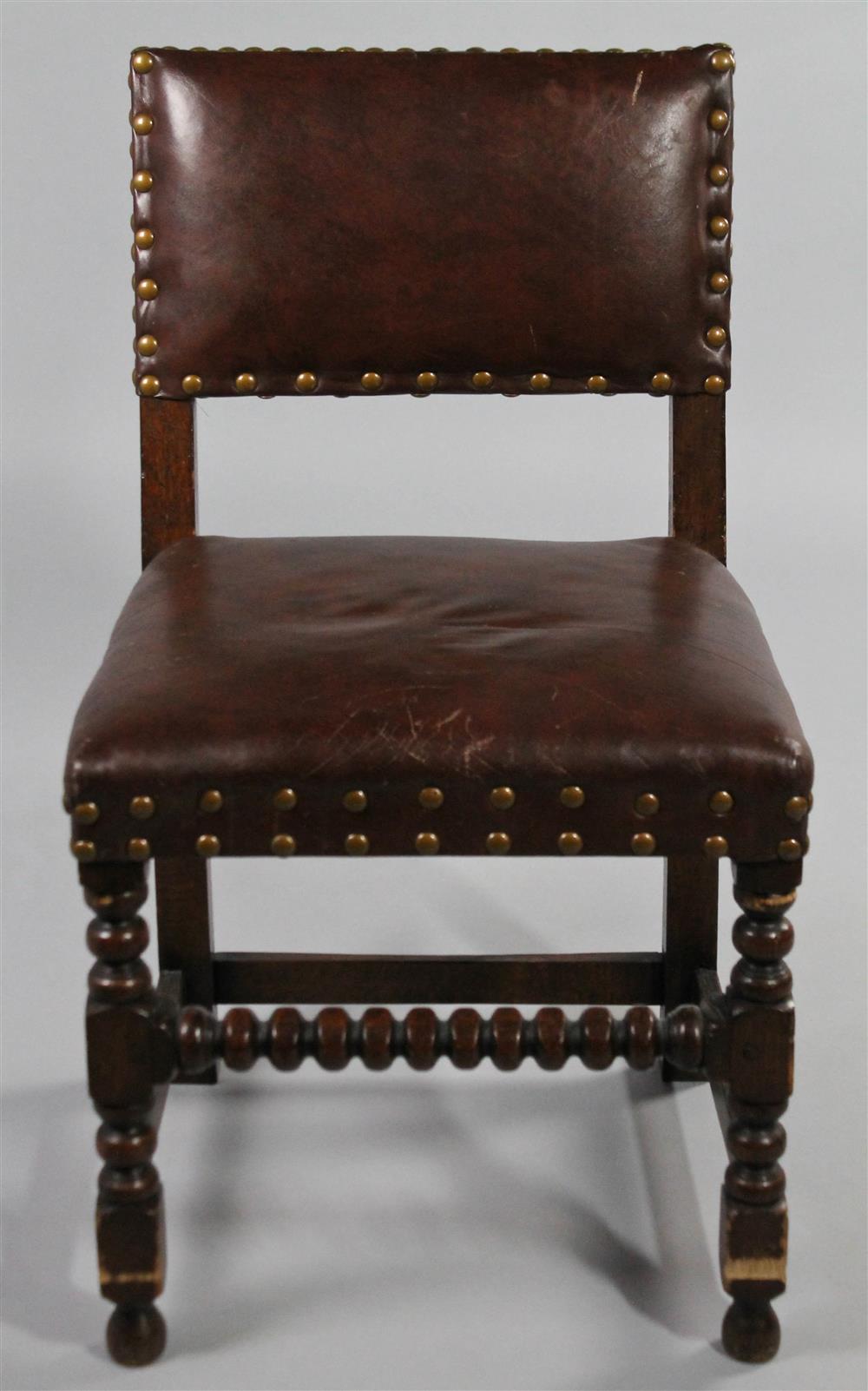 Appraisal: JACOBEAN STYLE LEATHER AND OAK CHAIR having a padded back