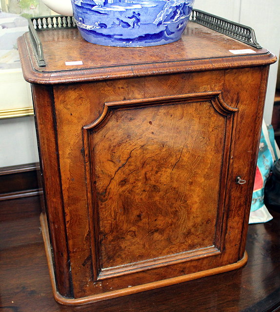 Appraisal: A VICTORIAN BURR WALNUT VANEERED TABLE CABINET with galleried top