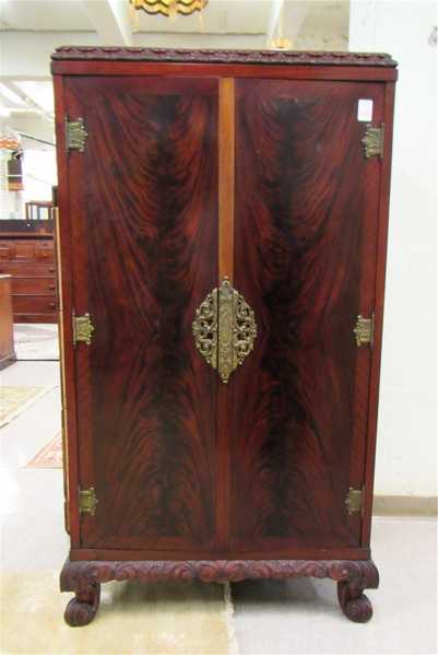 Appraisal: CARVED FLAME GRAIN MAHOGANY DOUBLE-DOOR WARDROBE Continental early th century