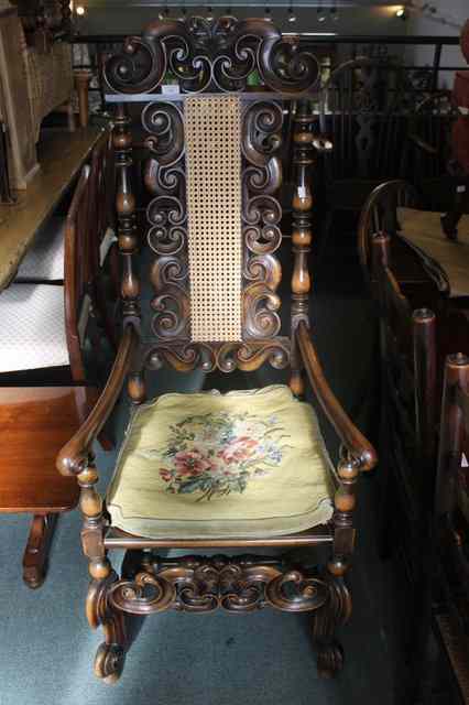 Appraisal: A CAROLEAN STYLE ELBOW CHAIR with tall back and cane