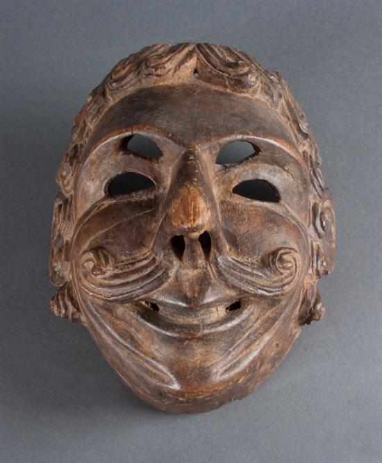 Appraisal: Guatemalan carved wooden mask representing a Conquistador late th Century