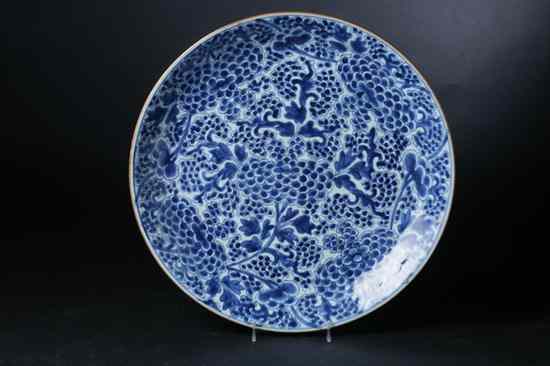 Appraisal: CHINESE BLUE AND WHITE PORCELAIN CHARGER Kangxi period Floral decoration