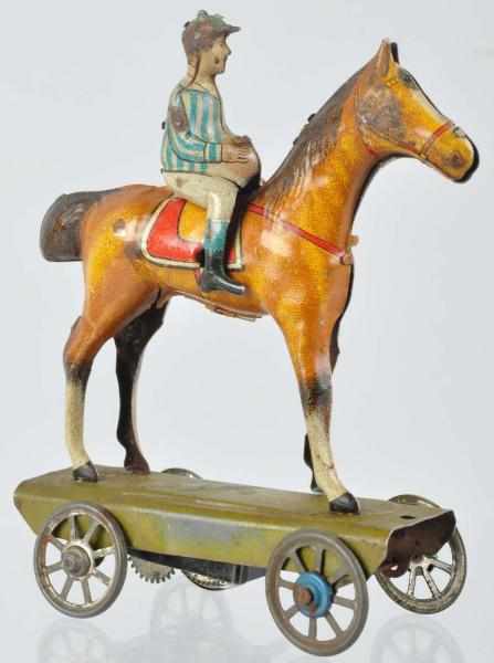 Appraisal: Tin Litho Jockey on Horse Wind-Up Nickel Toy German Marked