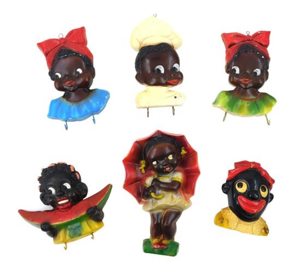 Appraisal: BLACK AMERICANA Six ceramic African American wall hangings five have