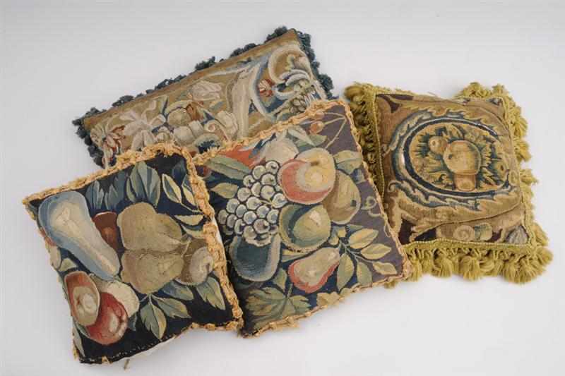 Appraisal: GROUP OF FOUR TAPESTRY-COVERED THROW PILLOWS Variously worked with fruit