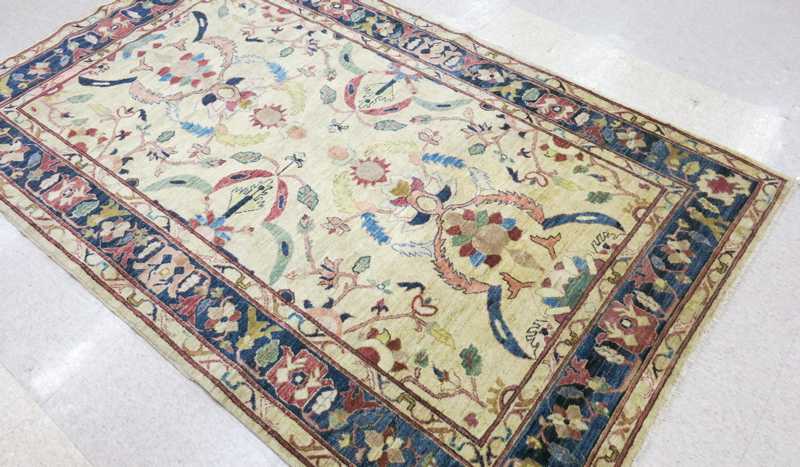 Appraisal: HAND KNOTTED ORIENTAL CARPET Pakistani Caucasian colorful floral design on