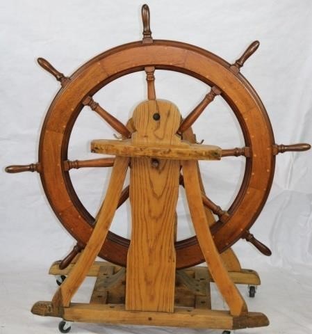 Appraisal: EARLY TH C SHIP'S WHEEL AND STEERING CARRIAGE WHEEL IS