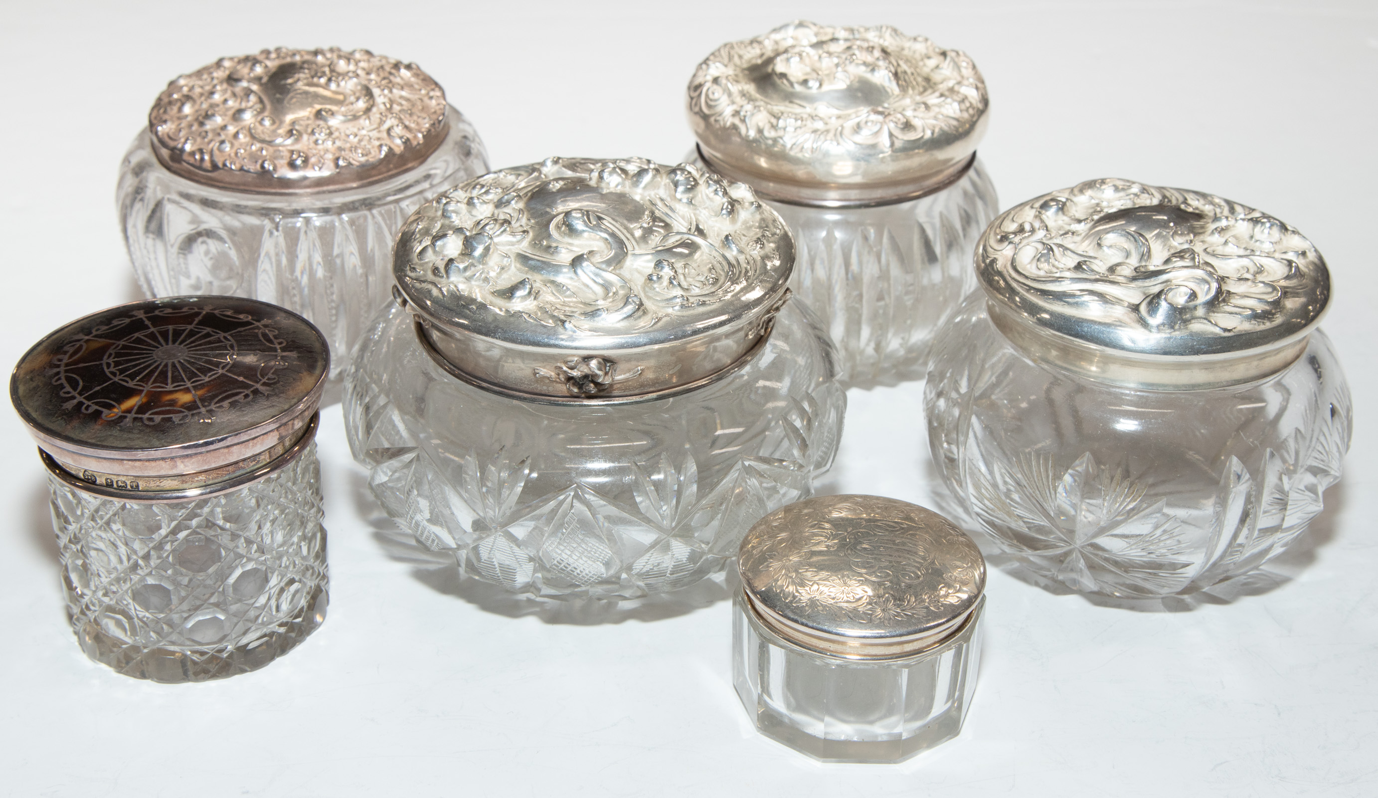 Appraisal: SIX SILVER-MOUNTED CRYSTAL DRESSER JARS Four with Art Nouveau repousse