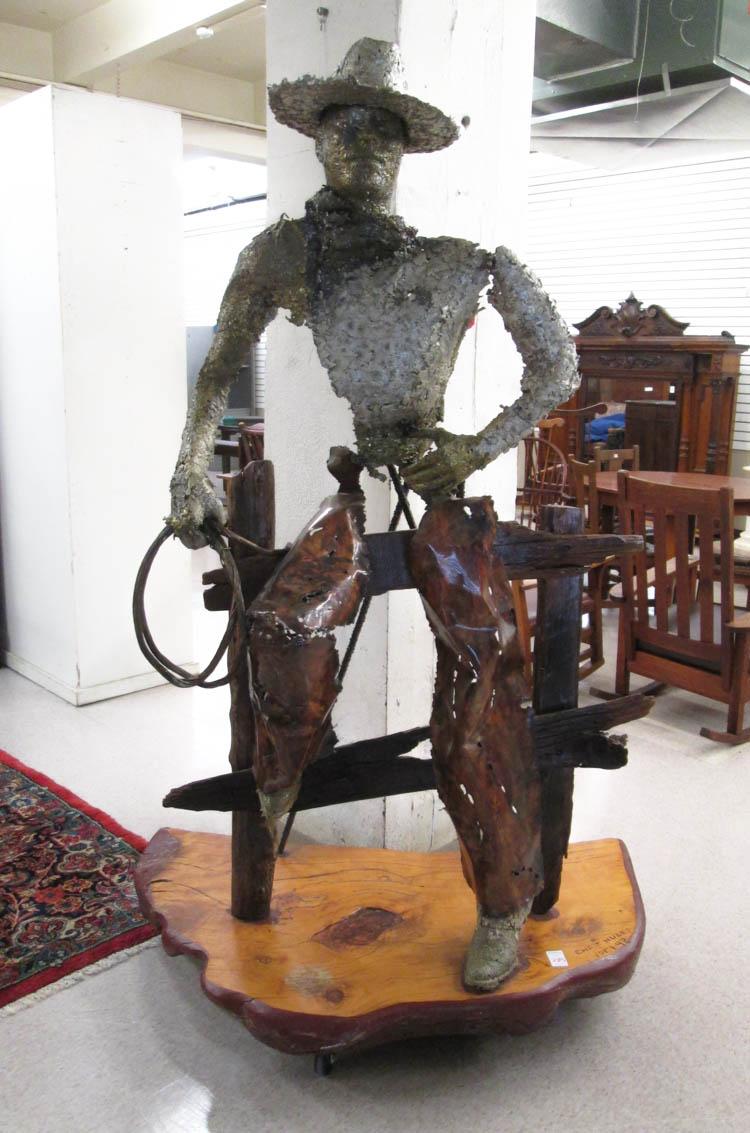 Appraisal: CHRIS HUGES MIXED MEDIA SCULPTURE American st century Cowboy sitting