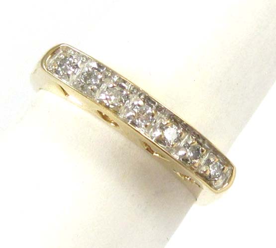 Appraisal: DIAMOND AND FOURTEEN KARAT GOLD RING set with seven round-cut