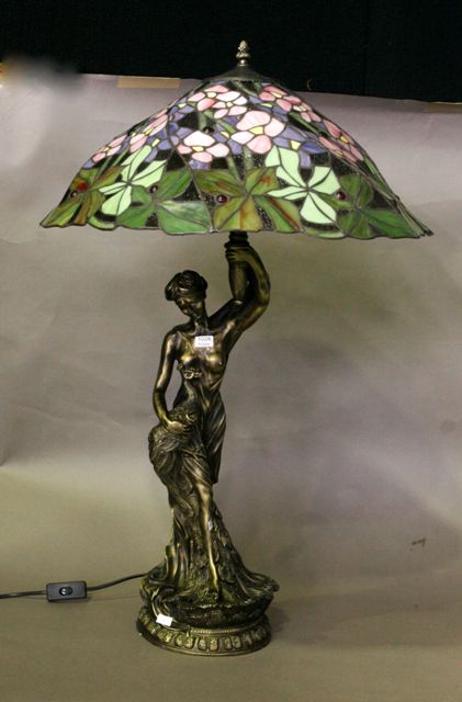 Appraisal: A leadlight and cast brass table lamp in the manner