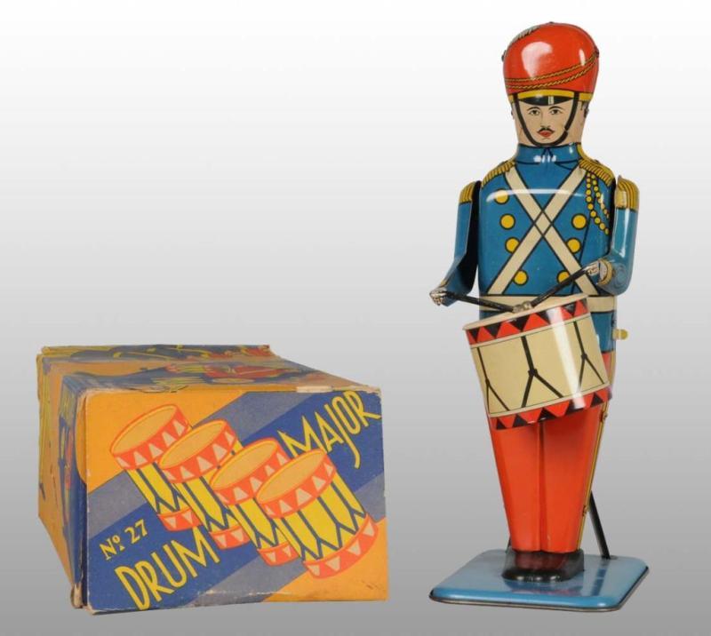 Appraisal: Tin Wolverine Drum Major Wind-Up Toy Description Made by Wolverine