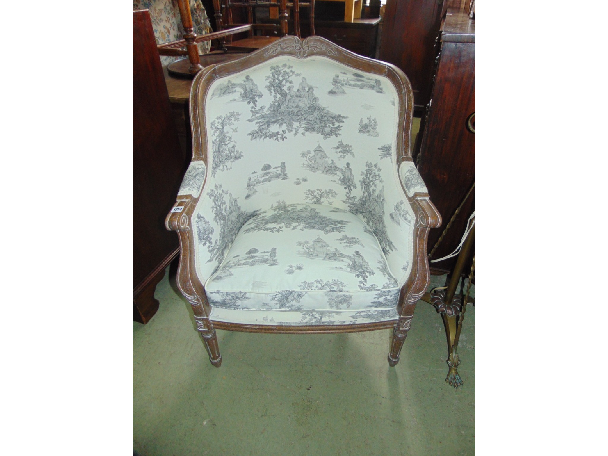 Appraisal: A reproduction drawing room chair in the th century style