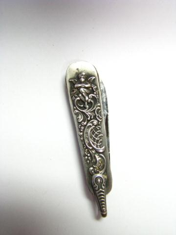 Appraisal: Sterling silver pocket knife Victorian motif Cupid and scroll