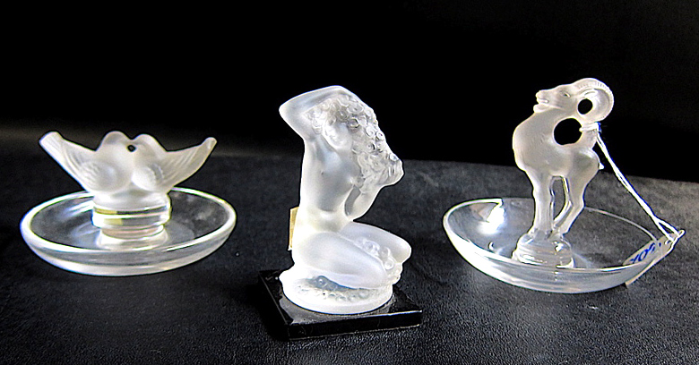 Appraisal: THREE LALIQUE CRYSTAL PIECES kneeling nude figure with one arm