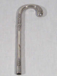 Appraisal: A silver parasol handle with classical decoration unascribed marks probably