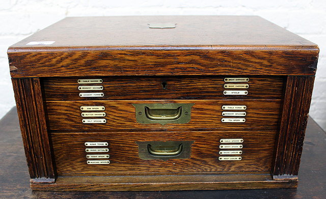 Appraisal: AN OAK CASED CANTEEN BOX containing a matched canteen of