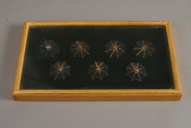 Appraisal: Gilt framed small wire constructions of spiders and octagonal spider