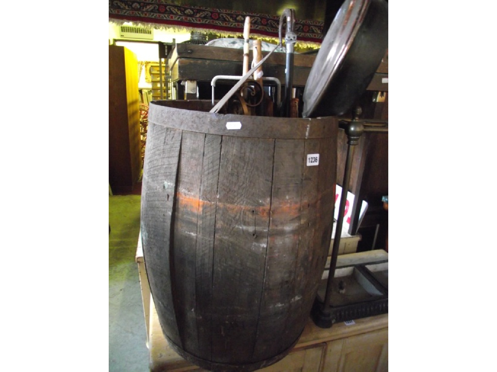 Appraisal: A coopered oak and steel banded barrel and contents including