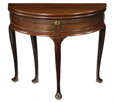 Appraisal: A George II mahogany tea table the hinged demi-lune top