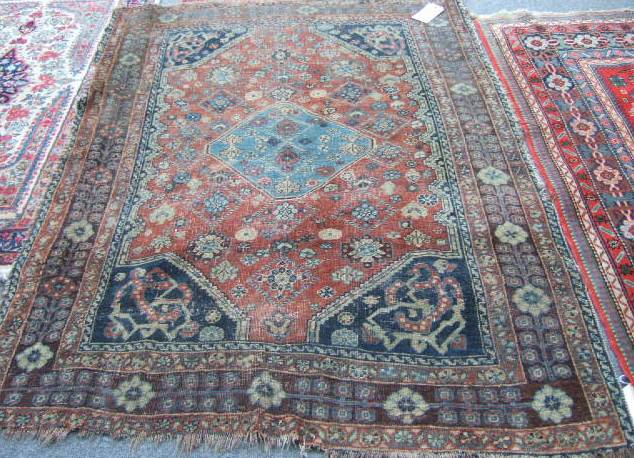 Appraisal: A Guasghai rug South West Persia the madder field with