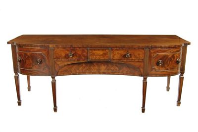 Appraisal: A large Regency mahogany barrel front sideboard inlaid ebony stringing