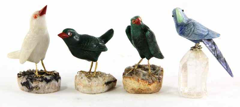 Appraisal: Four Carved Hardstone Birds th century each mounted to a