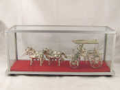 Appraisal: An Indonesian white metal model of an open carriage with