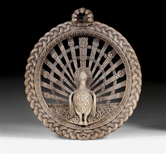 Appraisal: A ROUND WOODEN PEACOCK WINDOW India th c Height cm