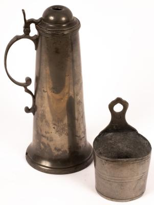 Appraisal: A pewter flagon with scrolled handle and lid cm high