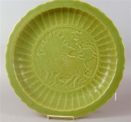 Appraisal: Two Chinese Ming-style celadon chargers early th century Of barbed