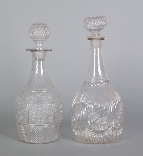 Appraisal: Two colorless blown three mold decanters th c h h