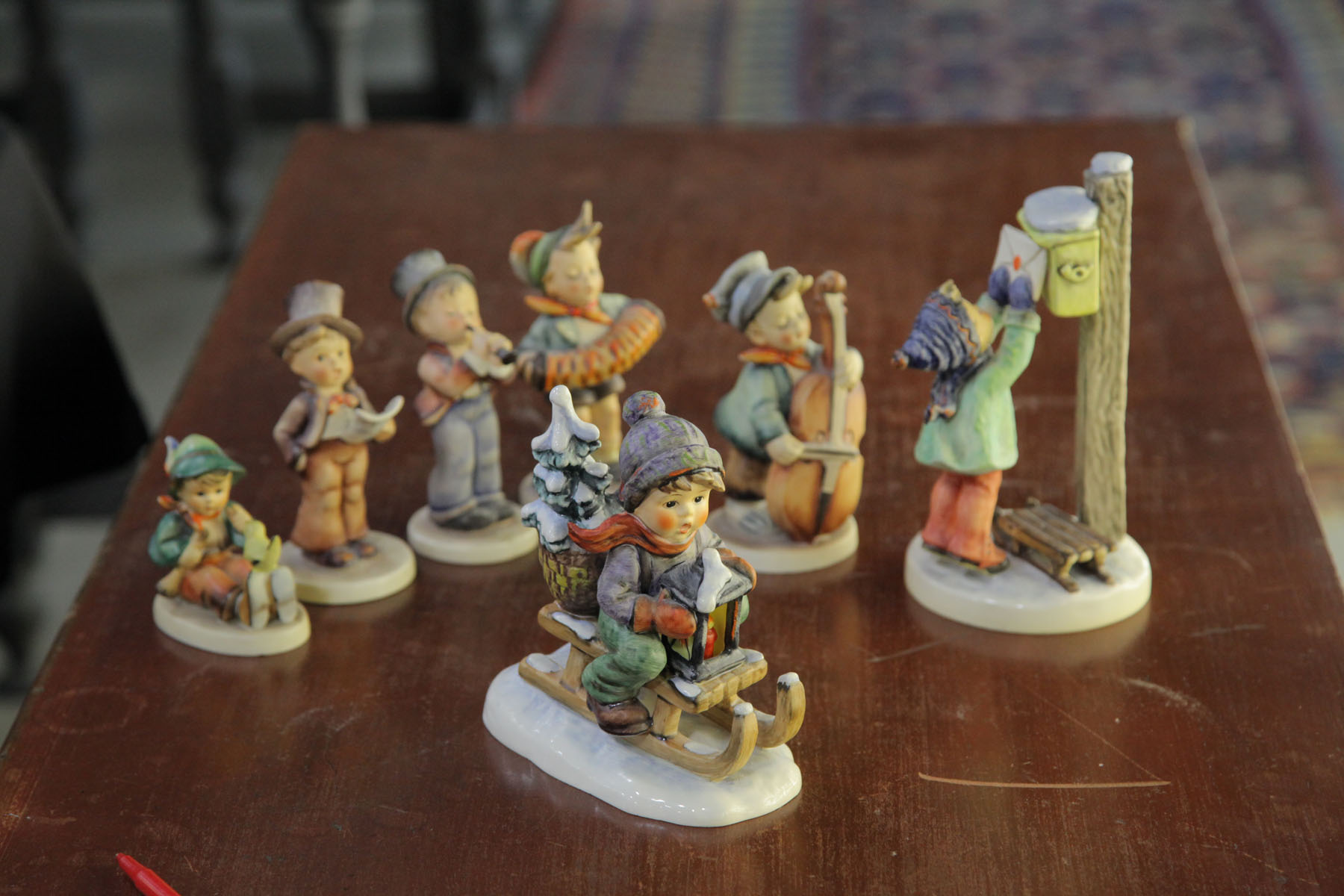 Appraisal: SEVEN HUMMEL FIGURINES German th century ''A Letter to Santa''