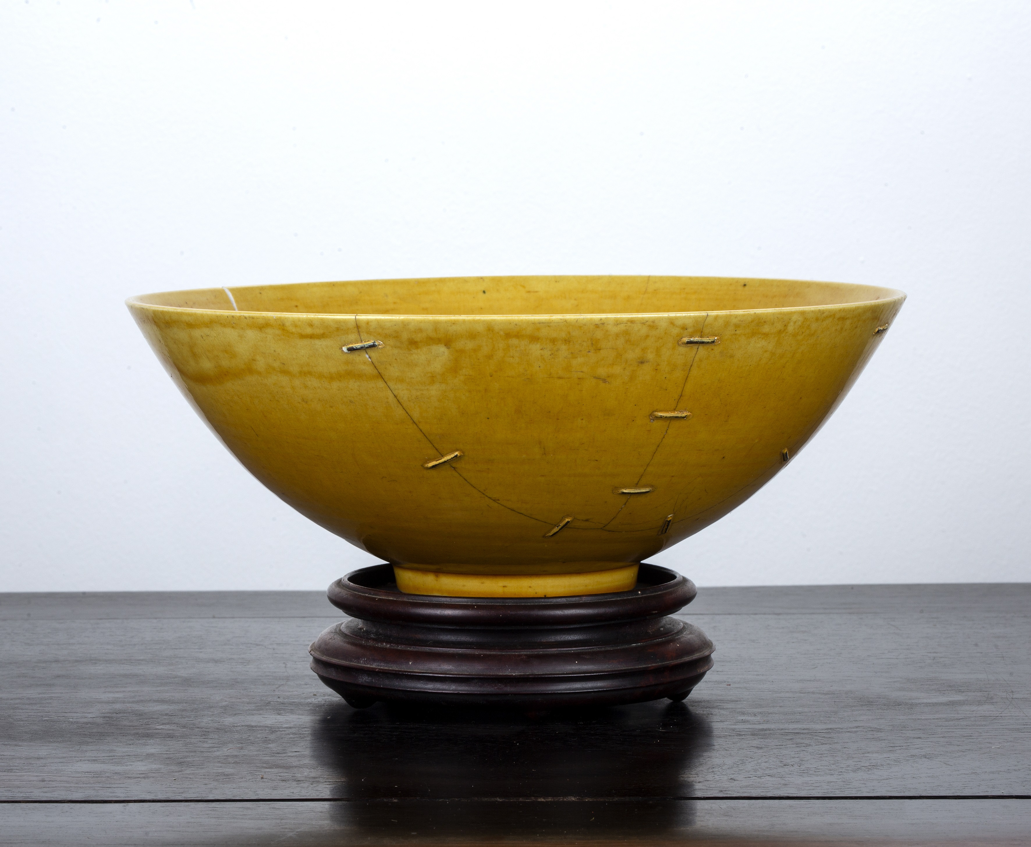 Appraisal: Yellow glazed bowlChinese of slightly rounded form with Kangxi impressed