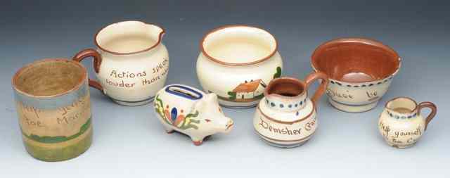 Appraisal: A COLLECTION OF CERAMIC MOTTO WARE including jugs bowls hat