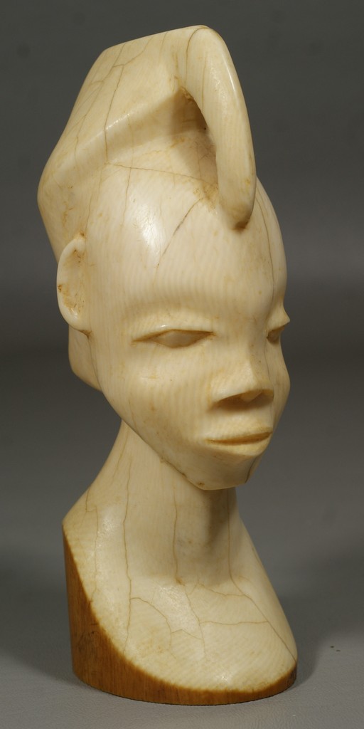 Appraisal: Carved ivory African bust of a woman multiple hairlines tall