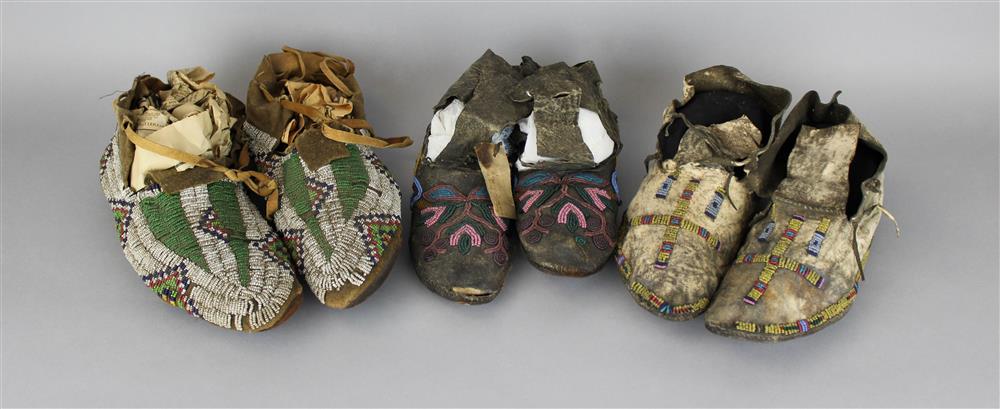 Appraisal: THREE PAIRS OF NATIVE AMERICAN BEADED HIDE MOCCASINS Provenance a