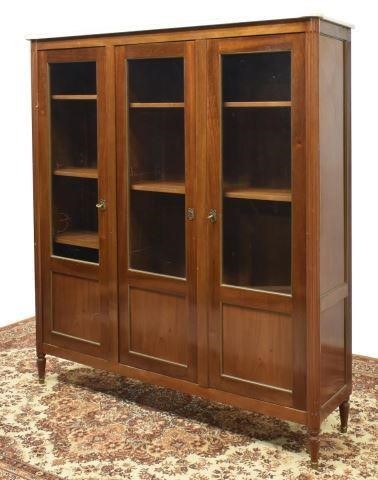 Appraisal: French Louis XVI style marble-top mahogany bookcase th c case