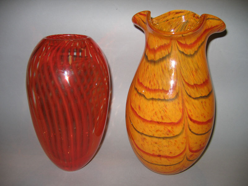 Appraisal: TWO BLOWN GLASS VASES Orange with red swags and ruffled