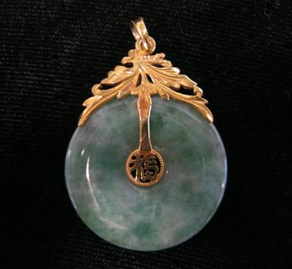 Appraisal: karat yellow gold and jade disk pendantL in